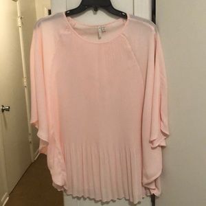 Pale pink tunic.